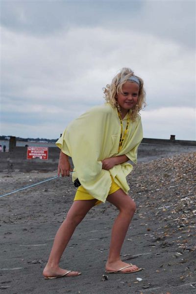 Teenage girl in yellow poncho
